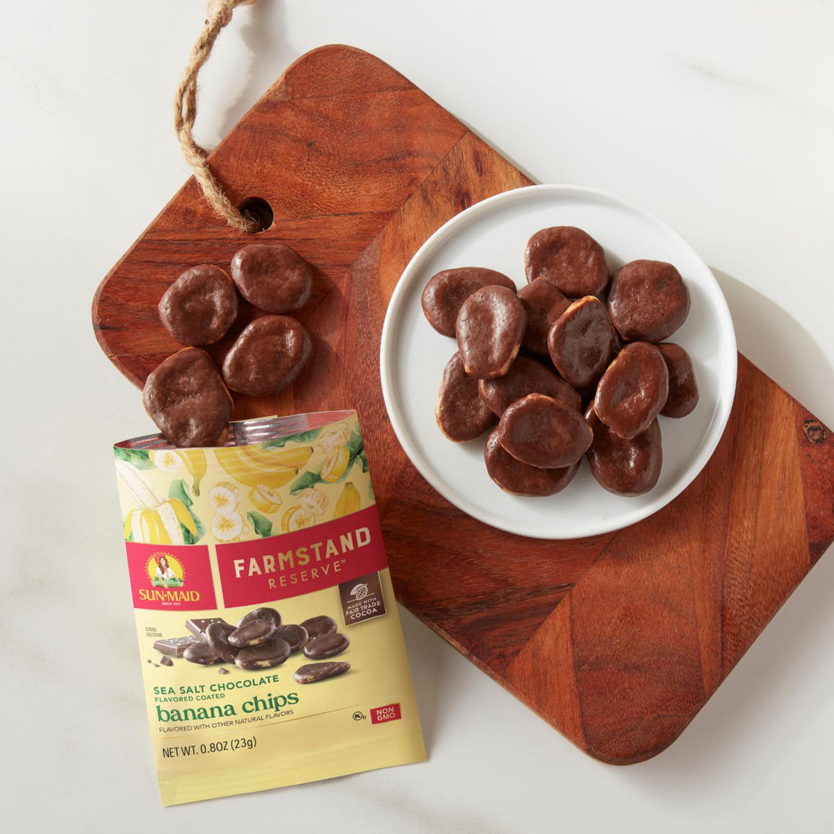 curated farmstand reserve product line with four flavor variants (cranberries, mixed berries, sea salt cocoa & caramel raisins, chocolate coated banana chips)